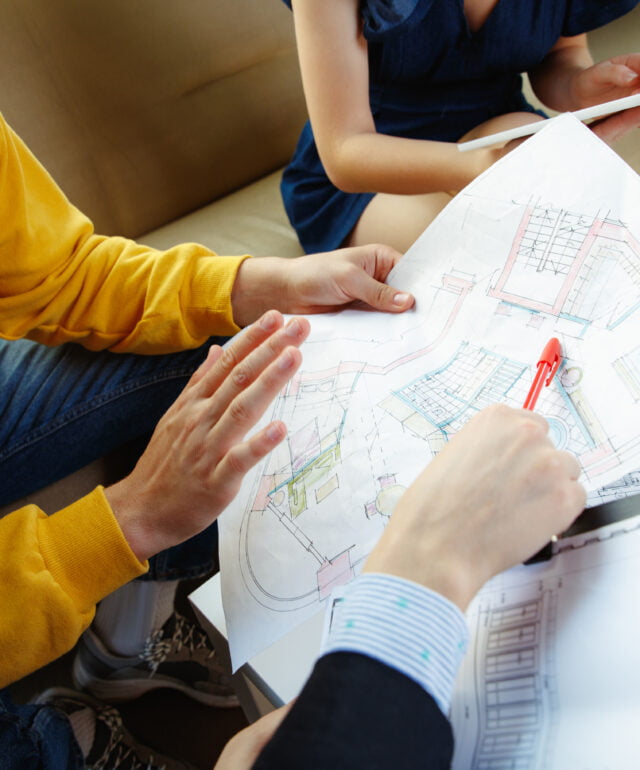 Interior designer working with young couple. Lovely family and professional designer or architector. Interior designer working with young couple. Lovely family and professional designer or architector.