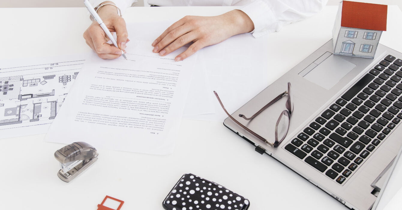 overhead-view-human-hand-putting-signature-official-paper-office overhead-view-human-hand-putting-signature-official-paper-office