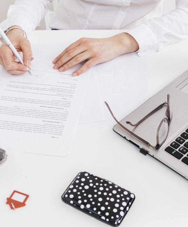 overhead-view-human-hand-putting-signature-official-paper-office overhead-view-human-hand-putting-signature-official-paper-office